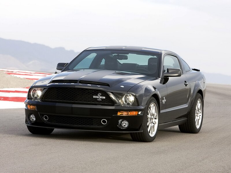 Black Shelby GT500 on racetrack