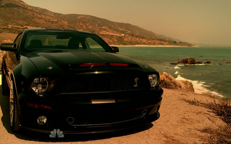 Black Shelby Mustang by the coast