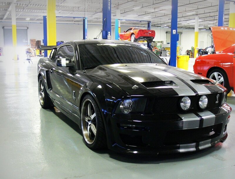 Black Shelby Mustang in garage