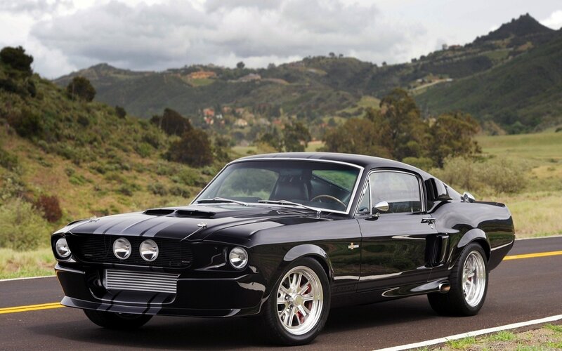 Black Shelby Mustang on a road