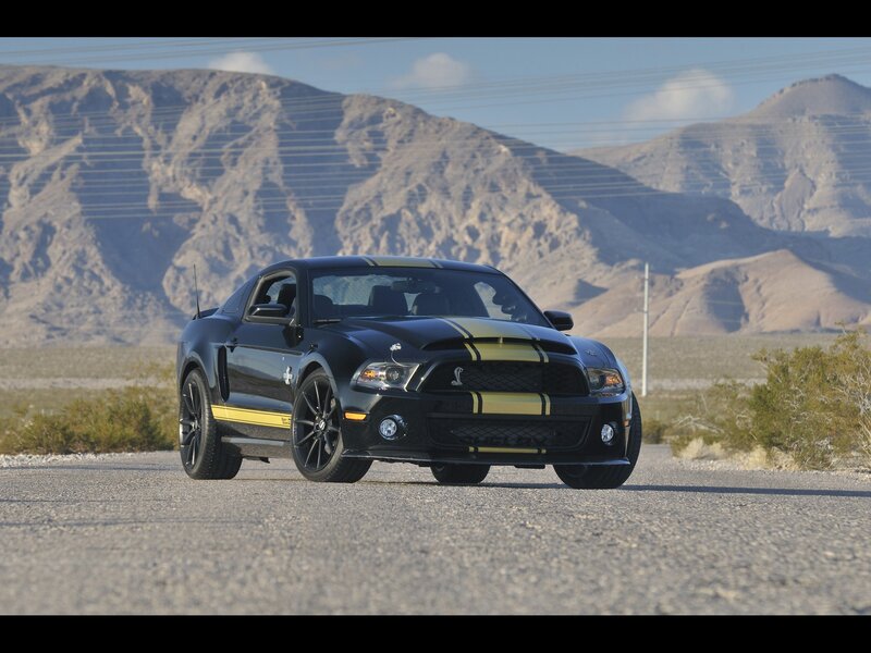 Black Shelby Mustang on desert road