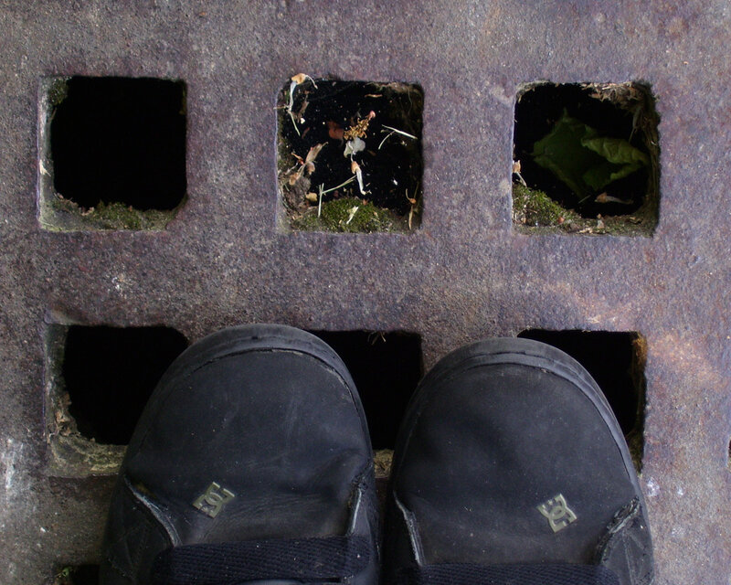 black shoes on a metal grate
