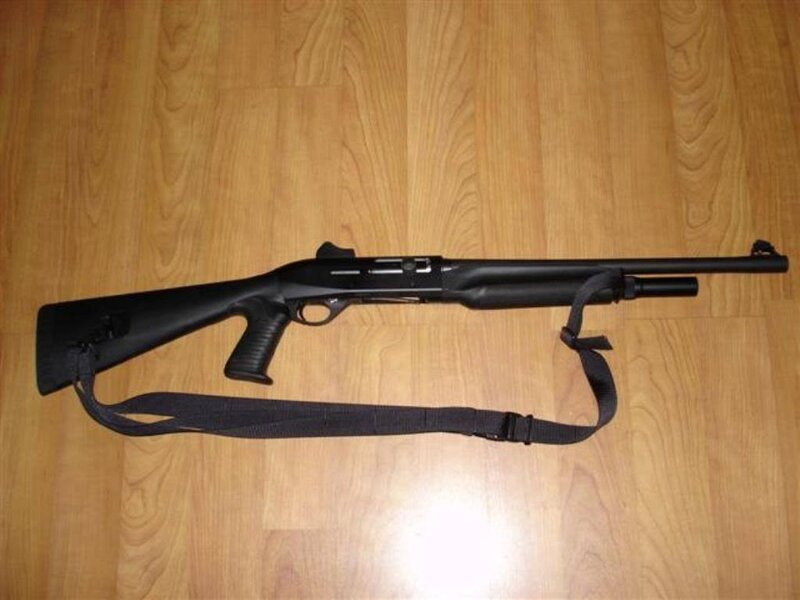 Black Shotgun on Floor — Neutral