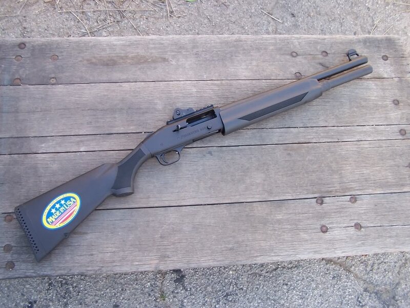 black shotgun on wooden surface