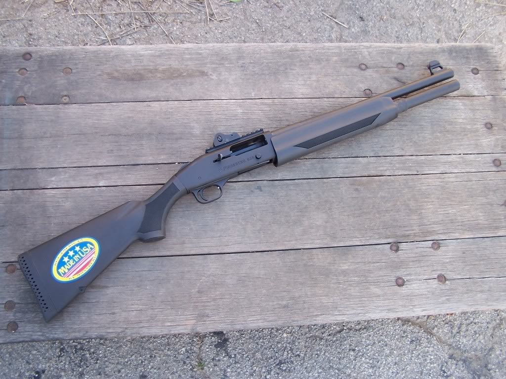 black shotgun on wooden surface