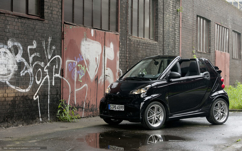 Black smart car in urban alley