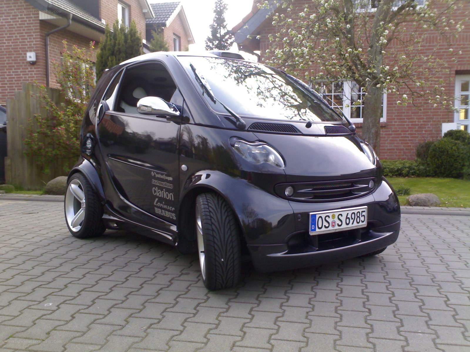 black smart car on driveway