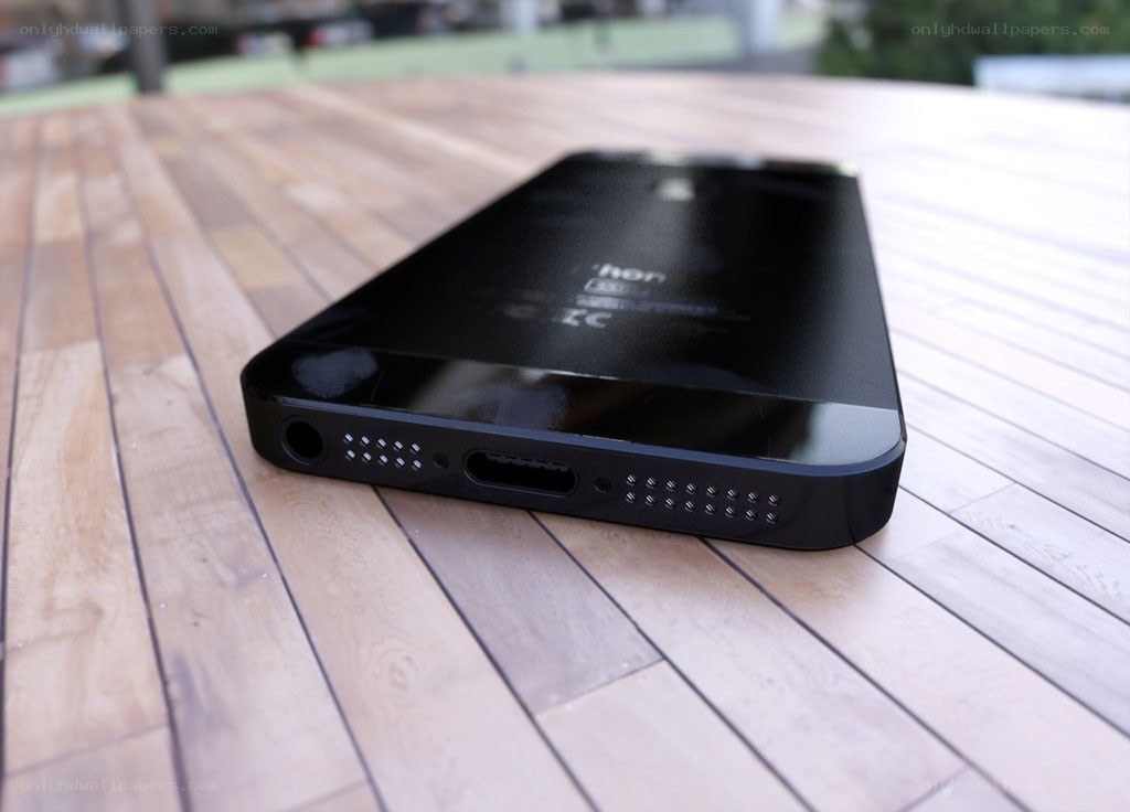 black smartphone on wooden table
