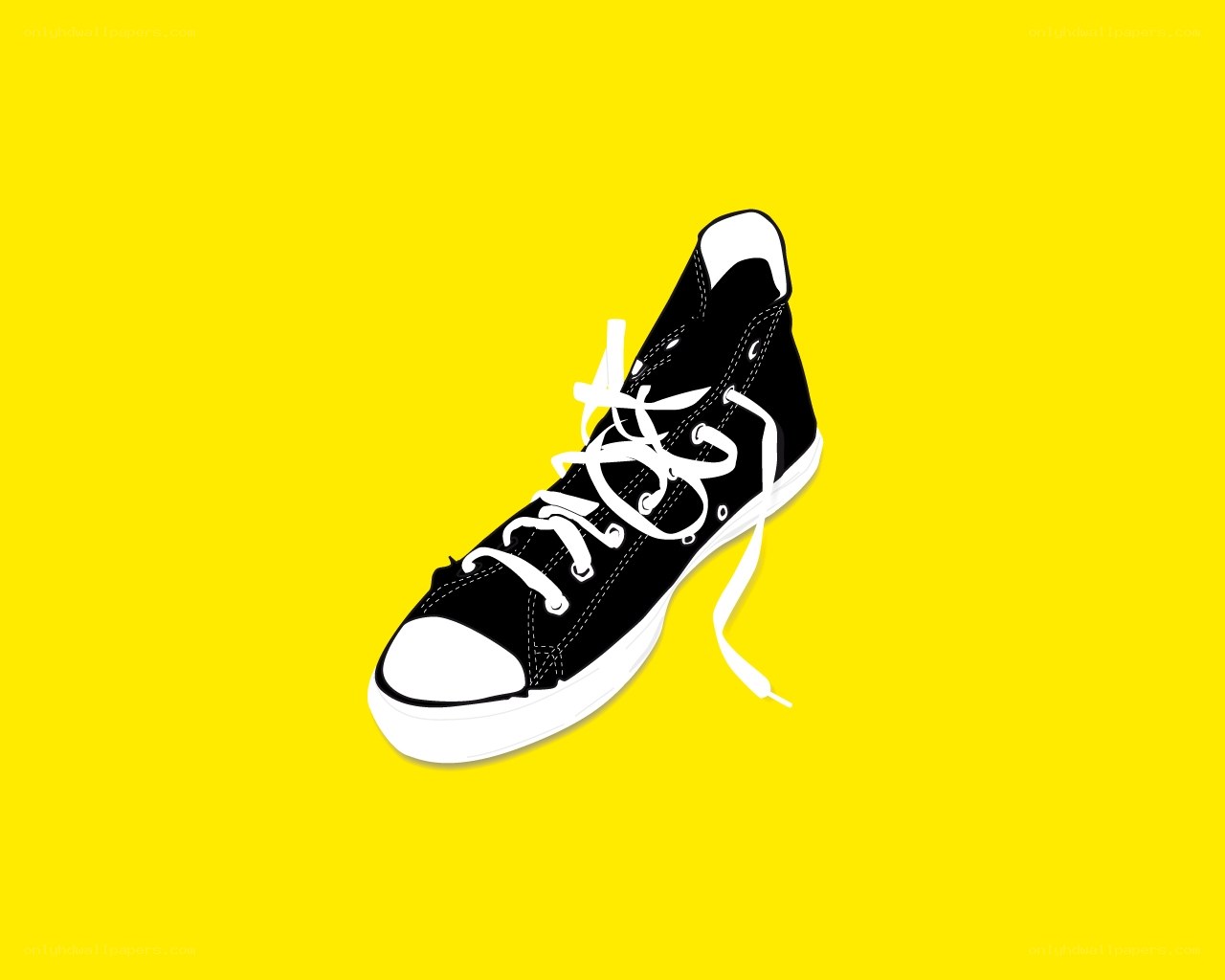 black sneaker on yellow
