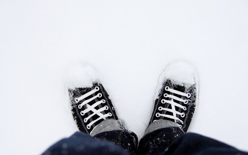 Black Sneakers in Snow — White