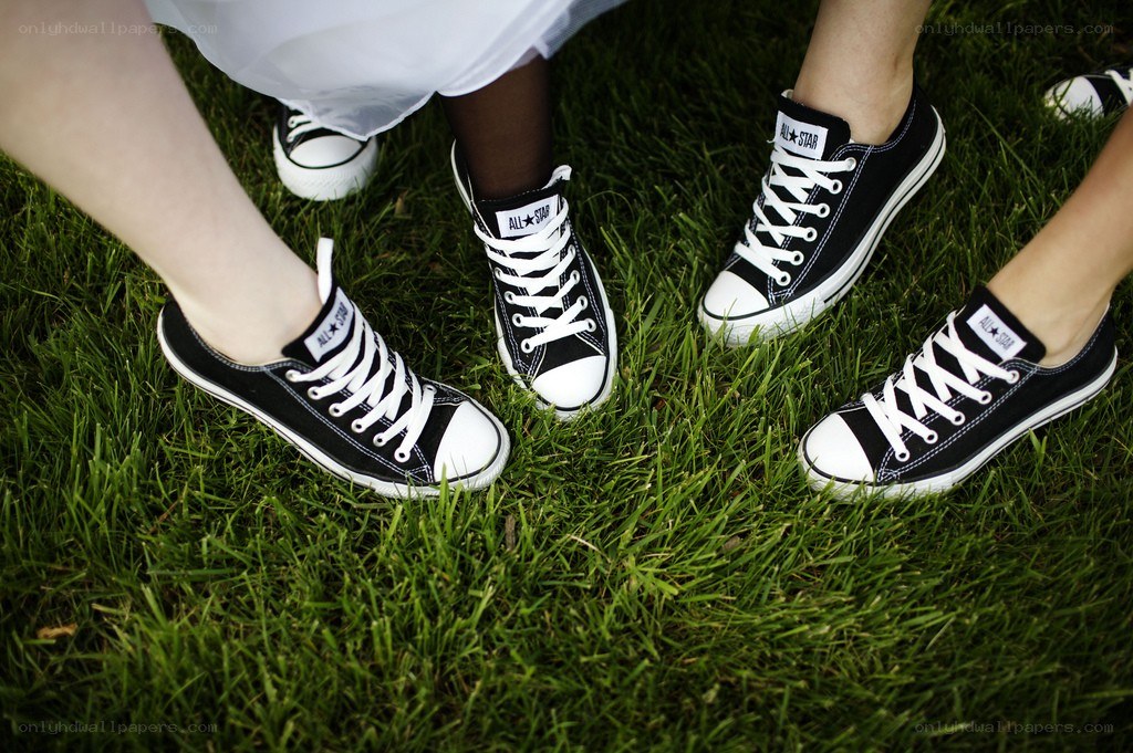 black sneakers on grass
