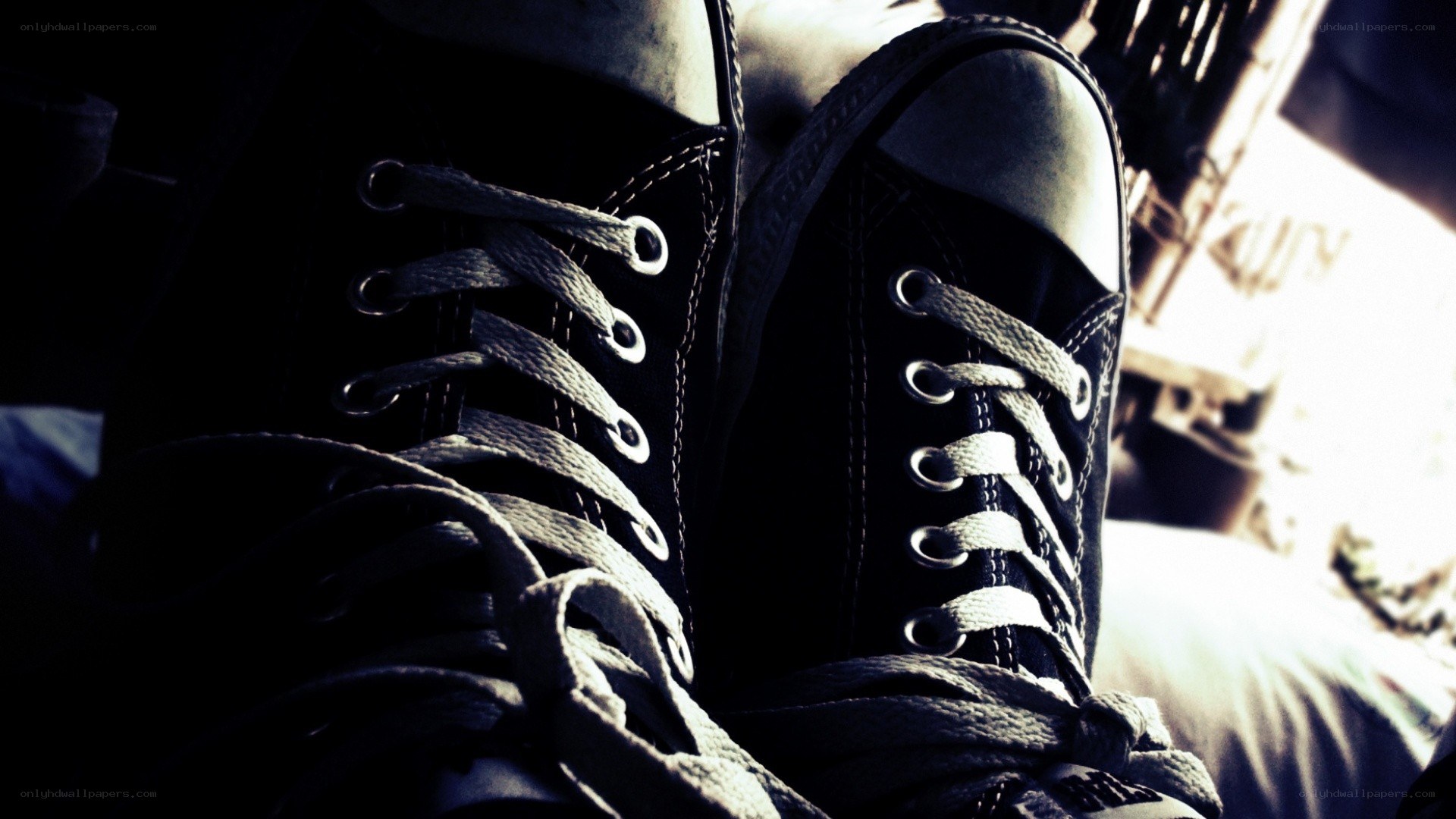 black sneakers with white laces
