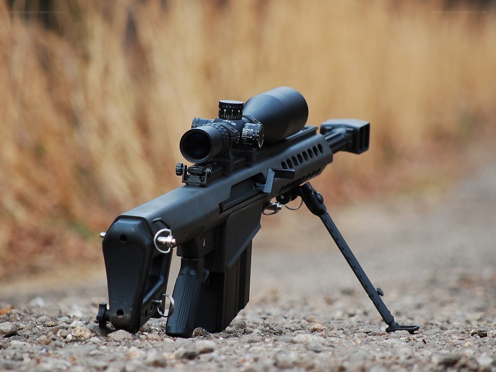 black sniper rifle with scope