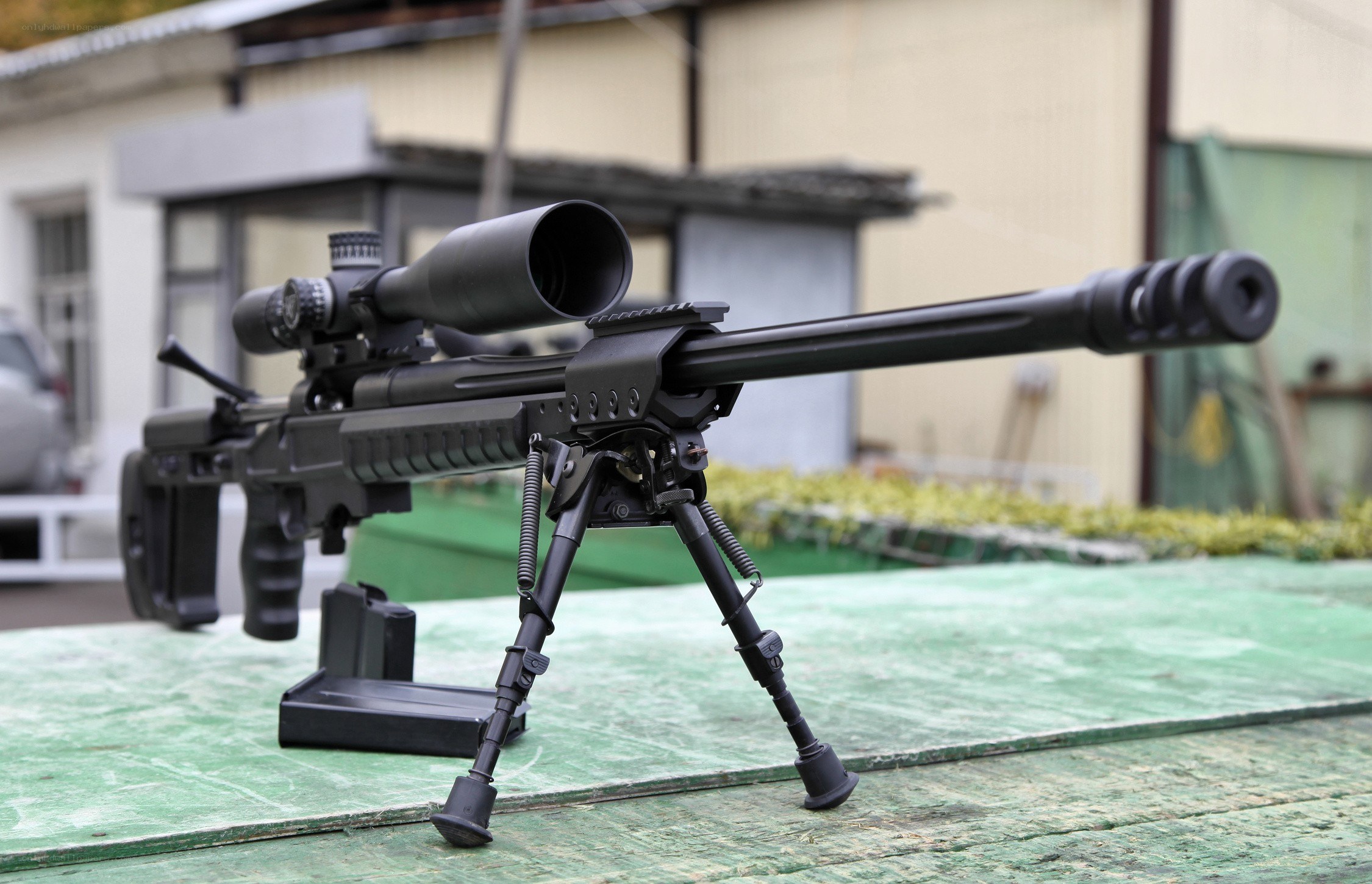 black sniper rifle with scope