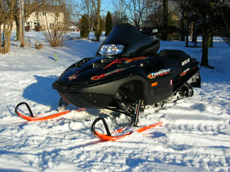 Black Snowmobile in Snow