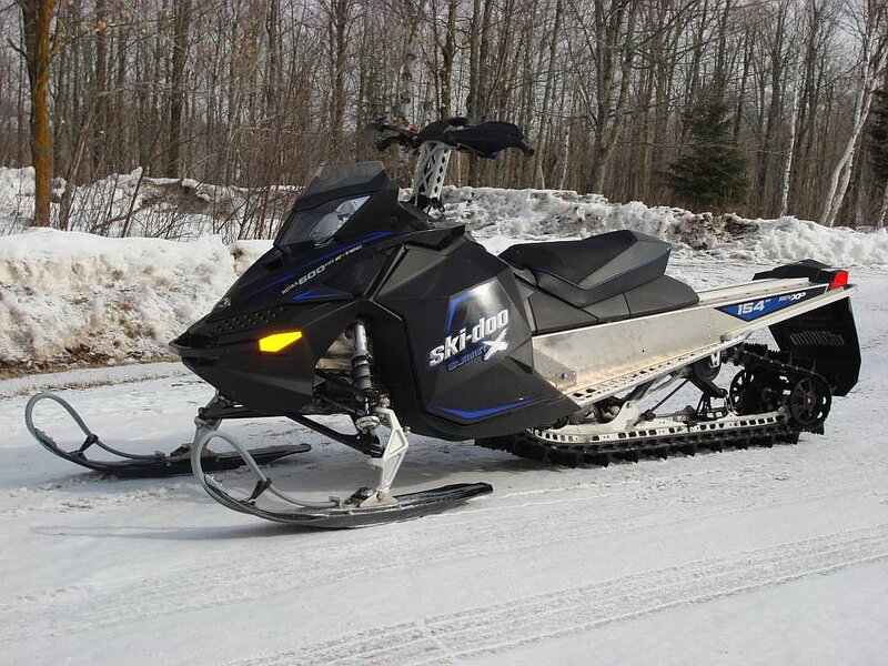 Black Snowmobile on Snow