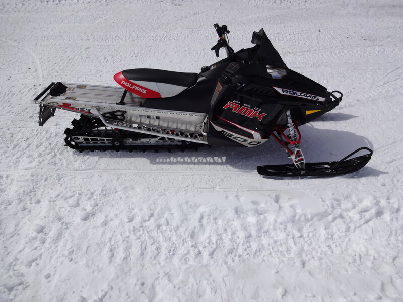 Black Snowmobile on Snow — White