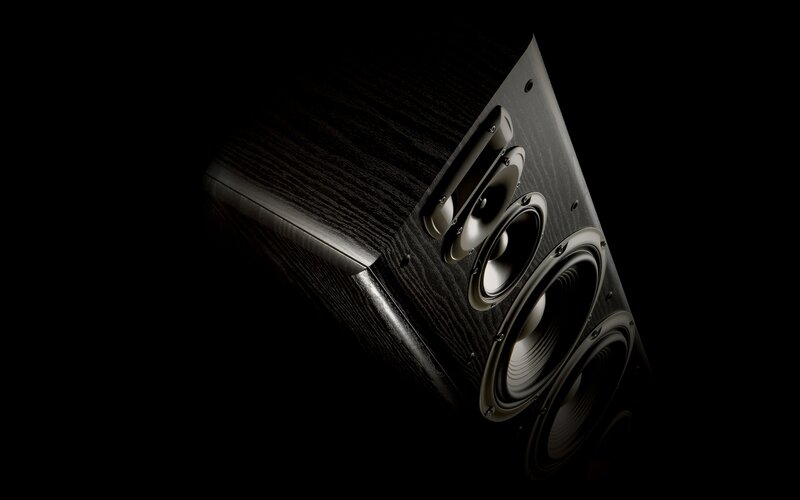 black speaker on dark background