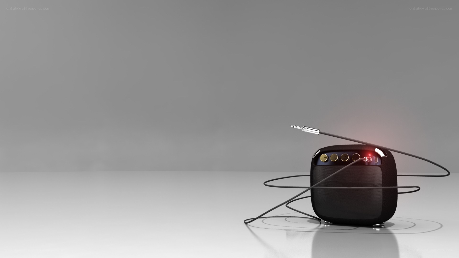 black speaker with cable