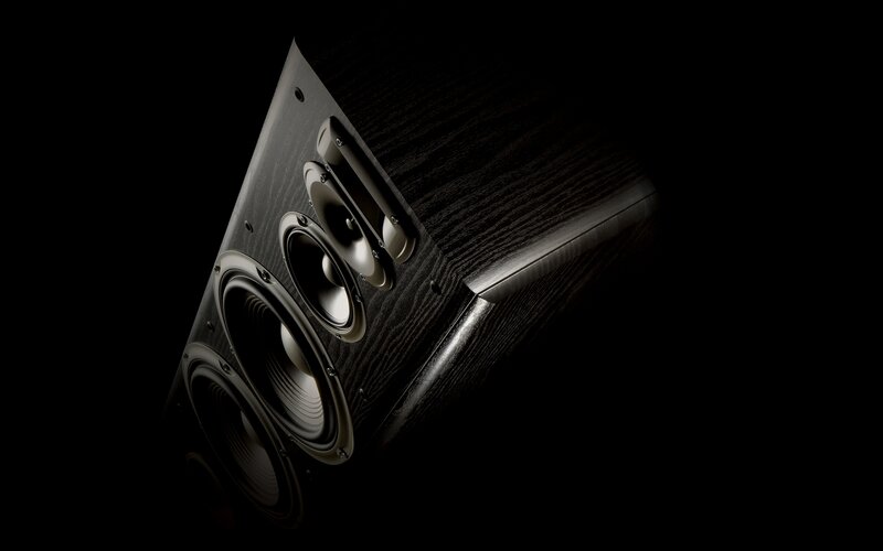 black speaker with wood finish
