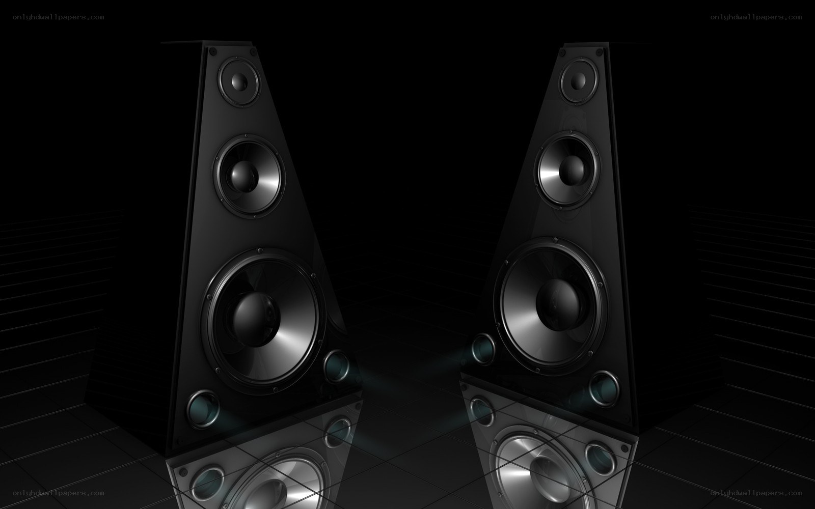 black speakers on dark floor