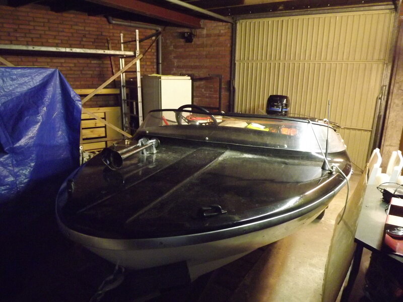 Black Speedboat in Garage