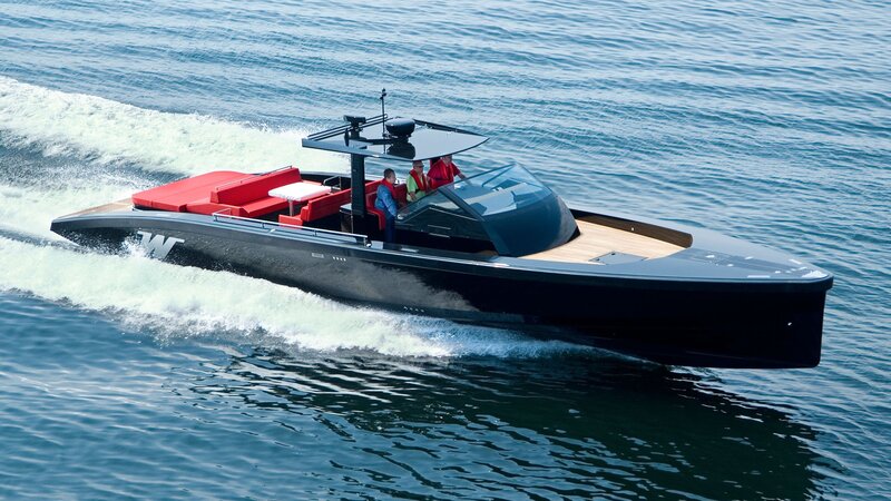 black speedboat on water