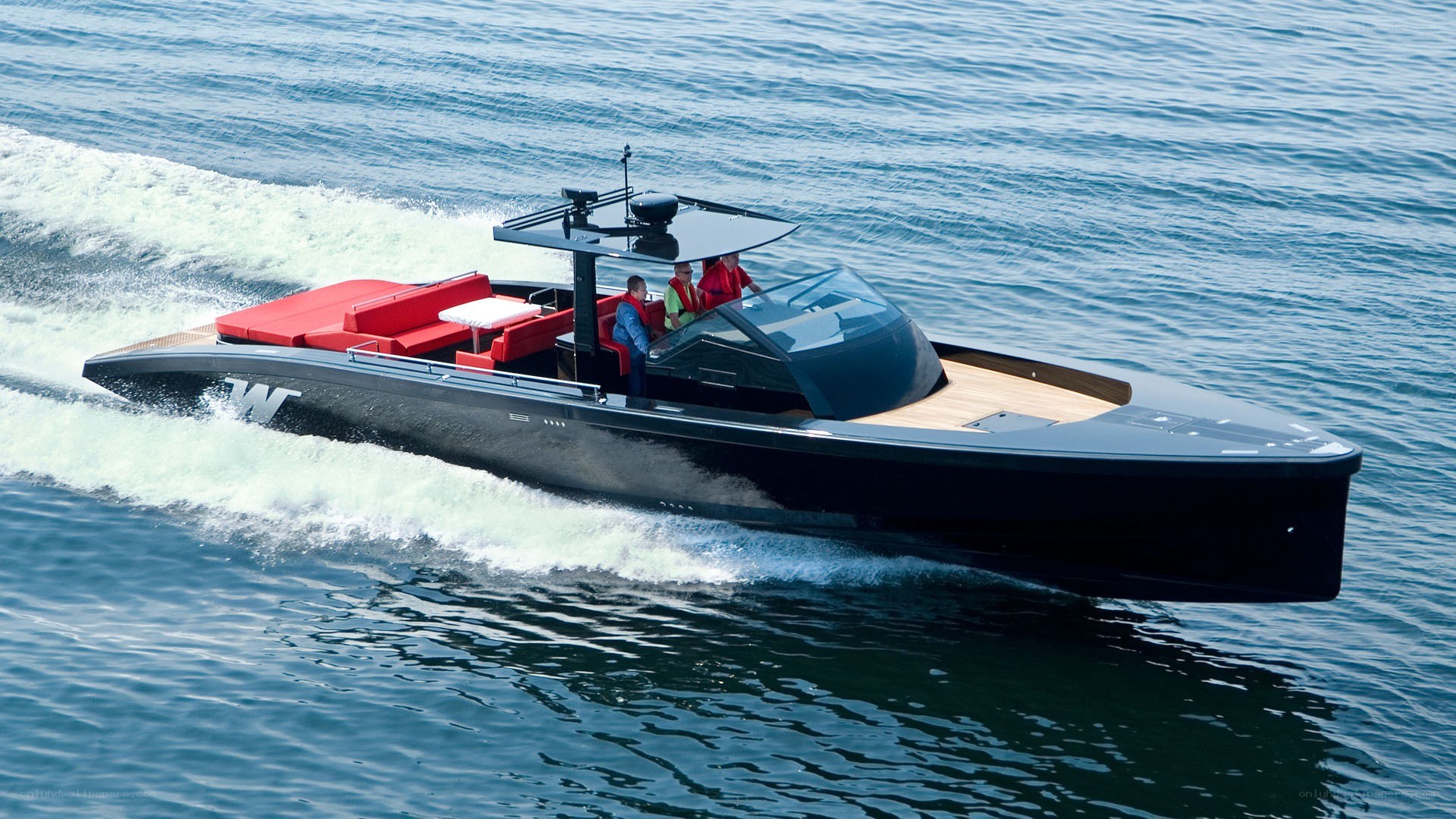 black speedboat on water