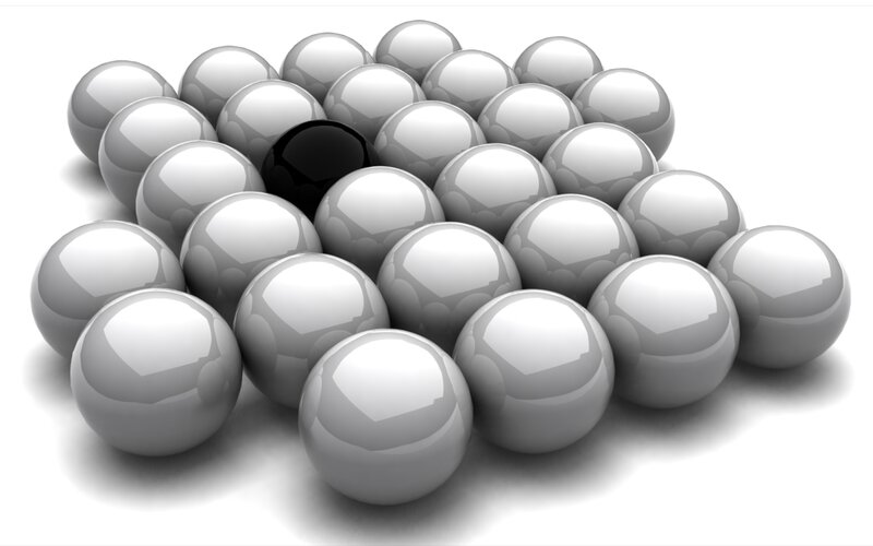 black sphere among white spheres