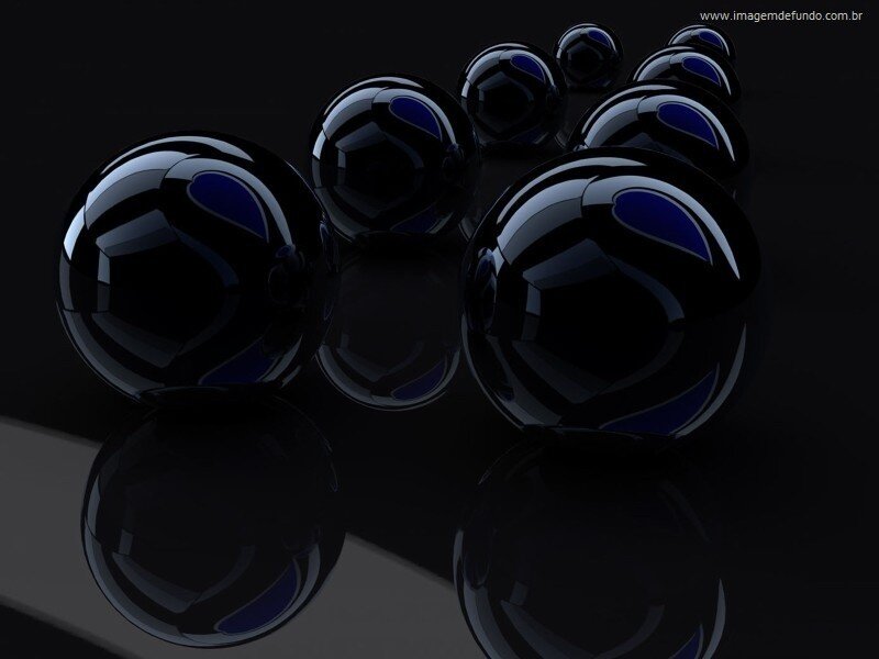 black spheres on reflective surface