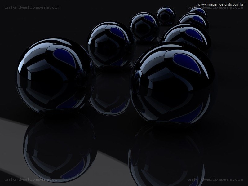 black spheres on reflective surface