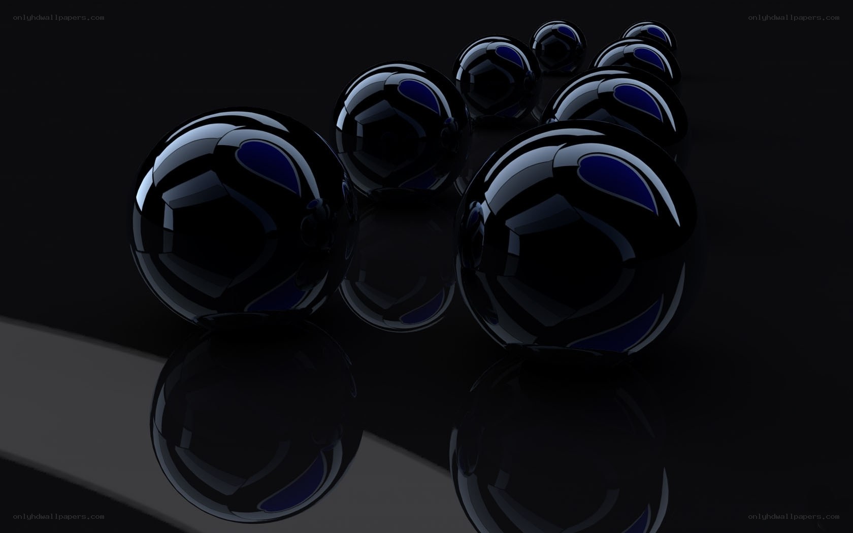 Black spheres on reflective surface