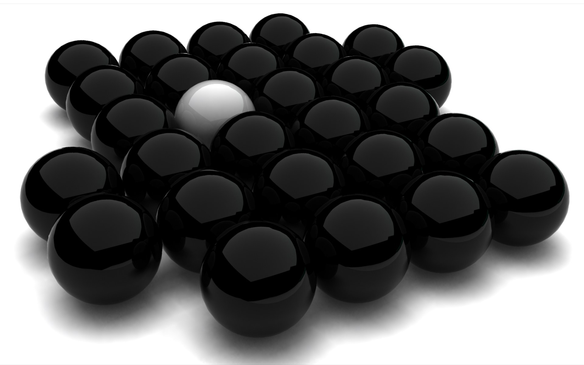 black spheres with one white sphere