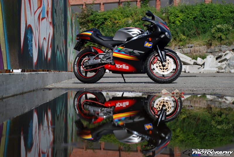 Black Sport Motorcycle — Dramatic, Afternoon, Photograph, Graffiti Wall