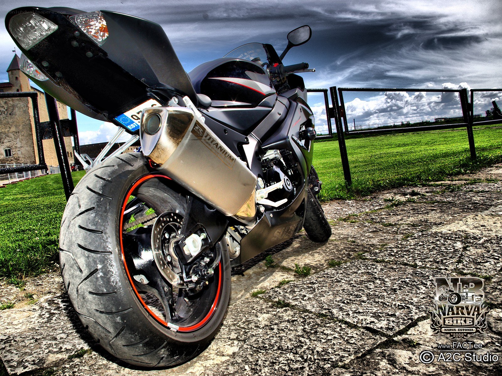 Black sport motorcycle on cobblestone
