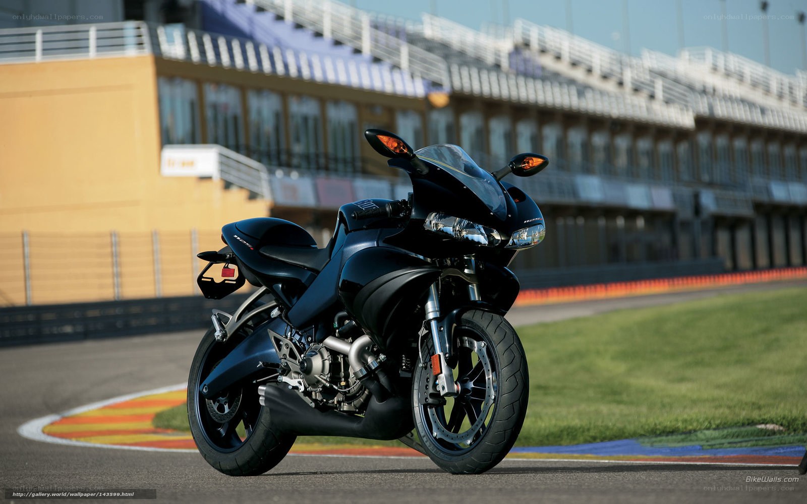 black sport motorcycle on racetrack
