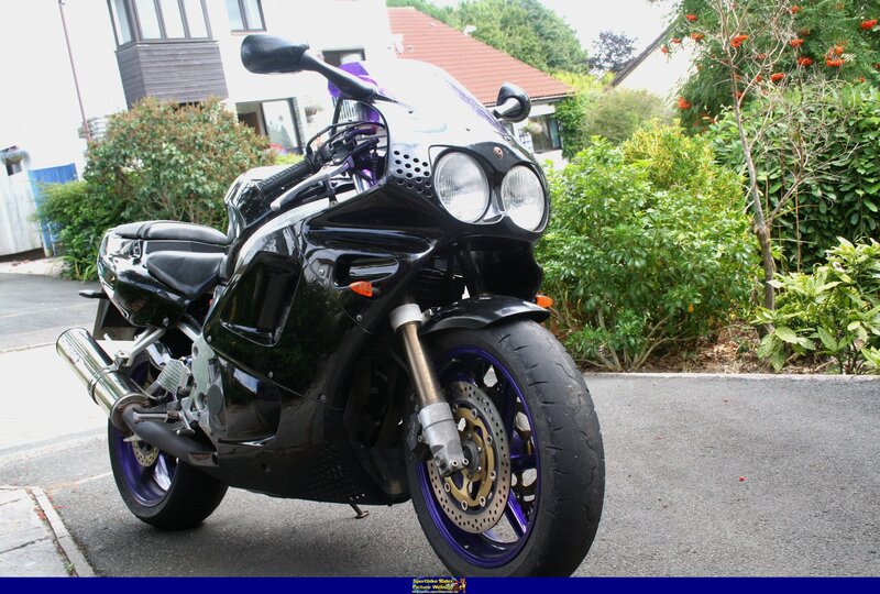 black sport motorcycle parked