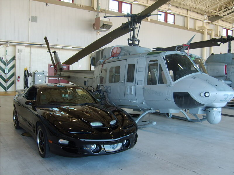 Black Sports Car and Helicopter