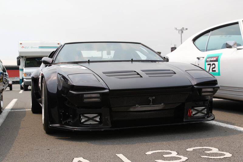 Black sports car at a race event