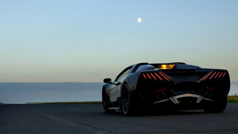 Black sports car at dusk
