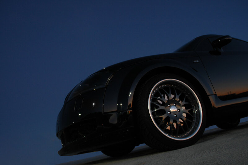 black sports car at dusk