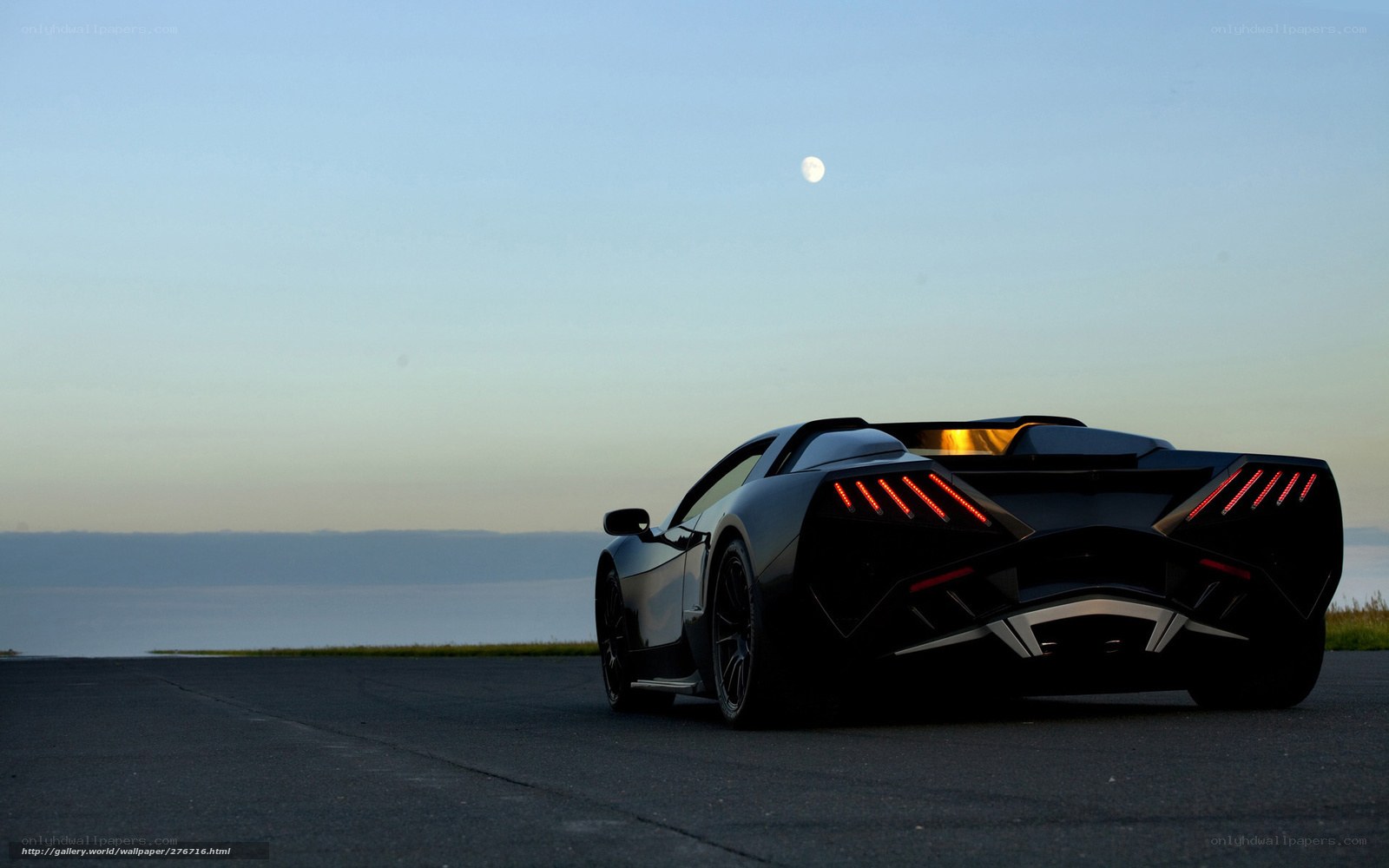 Black sports car at dusk