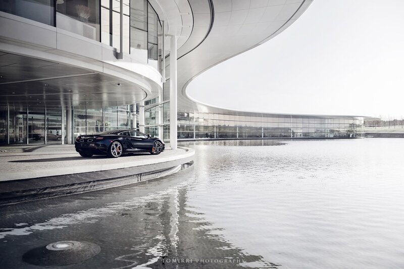 Black sports car at modern building
