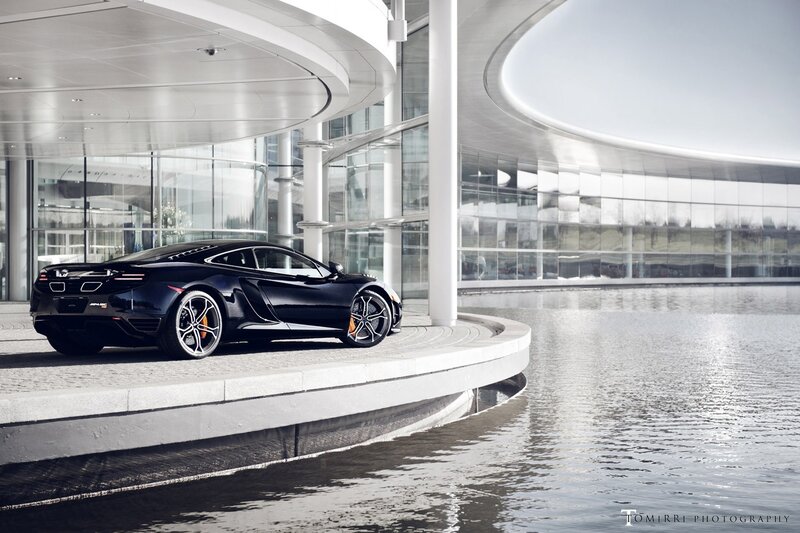 Black sports car at modern building