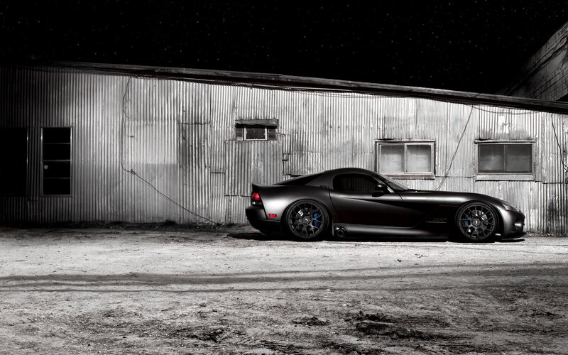 Black sports car at night
