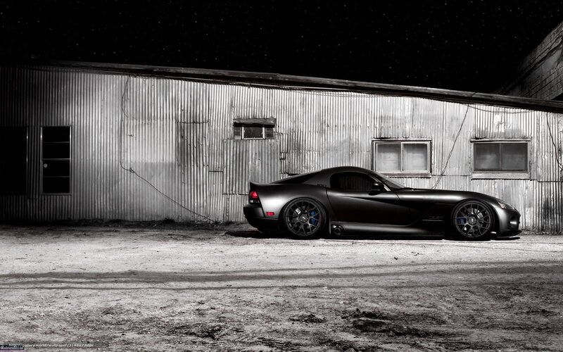 Black sports car at night