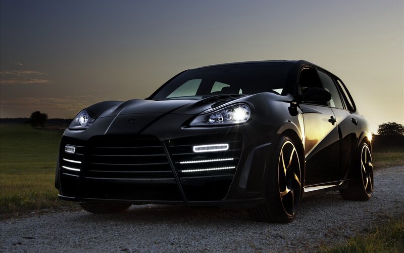 black sports car at sunset
