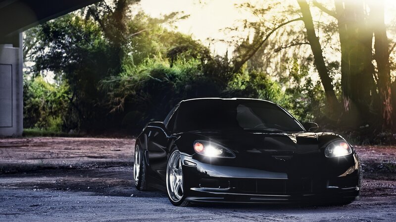 black sports car at sunset