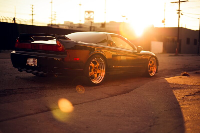 black sports car at sunset