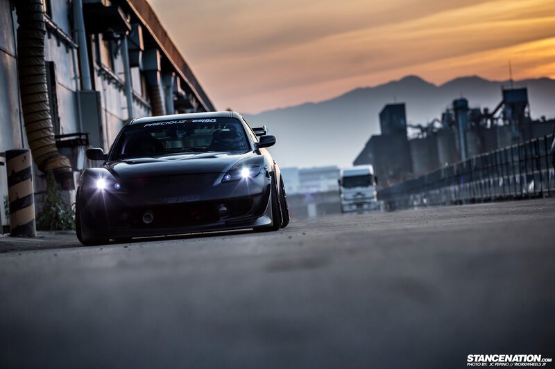 Black sports car at sunset